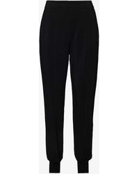 Stella McCartney - Tapered-leg High-rise Stretch-woven Trousers - Lyst