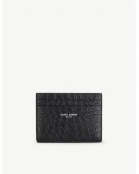 SAINT LAURENT - Branded animal-embossed leather wallet