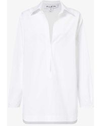 Alaïa - Long-sleeved Side-pocket Cotton Mini Dress - Lyst