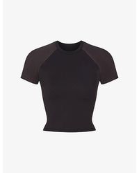 NikeSKIMS - Matte Shine Cropped Baby Tee Training Top - Lyst