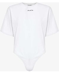 Alaïa - Brand-embroidered Round-neck Cotton-jersey Body - Lyst