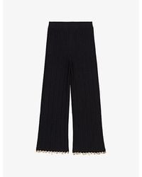 Maje - Charm-Embellished Knitted Cotton-Blend Trousers - Lyst