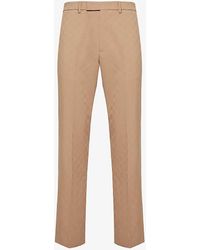 Gucci - Monogram-embellished Tapered-leg Woven Trousers - Lyst