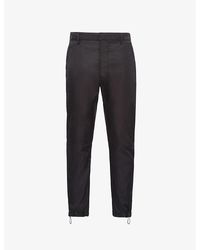 Prada - Brand-plaque Drawstring-hem Skinny-fit Slim-leg Re-nylon Trousers - Lyst