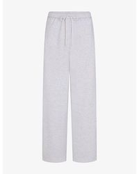 Skims - Classic Brand-Appliqué Straight-Leg Cotton-Blend Trousers - Lyst