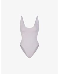 Skims - Signature Swim Scoop-neck Stretch Recycled-nylon Swimsuit - Lyst