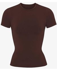 Skims - Smoothing Slim-fit Stretch-woven T-shirt X - Lyst