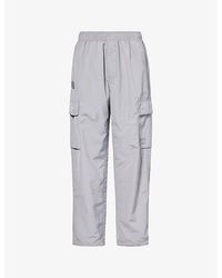 Aape - Logo-appliqué Relaxed-fit Woven Cargo Trousers - Lyst