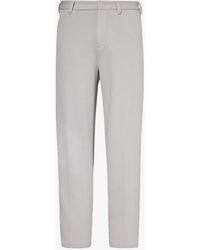 Emporio Armani - Logo-plaque Tapered-leg Cotton-blend Pique Trousers - Lyst