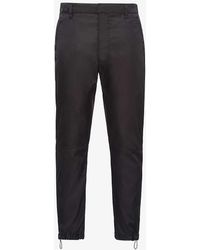 Prada - Brand-plaque Drawstring-hem Skinny-fit Slim-leg Re-nylon Trousers - Lyst