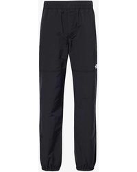 The North Face - Easy Wind Brand-embroidered Shell Trousers X - Lyst