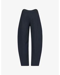 Alaïa - Round Wool Crepe Trousers - Lyst