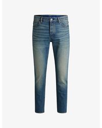 HUGO - Tapered-Leg Mid-Rise Stretch-Denim Jeans - Lyst