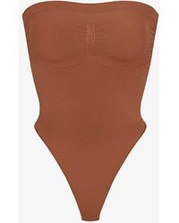 Skims - Seamless Sculpt Fitted Stretch-woven Body X - Lyst