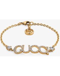 Gucci - Logo-script Embellished Antique Gold-toned Metal Bracelet - Lyst