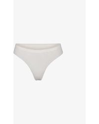 Skims - Smoothing Mid-rise Stretch-woven Thong - Lyst