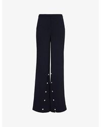 Stine Goya - Button-embellished Wide-leg Recycled-polyester Woven Trousers - Lyst