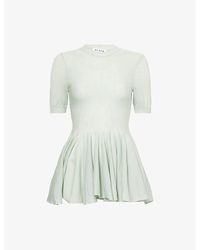 Alaïa - Peplum Fine-Knit Wool Top - Lyst