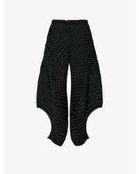 Issey Miyake - Curved Pleated Tapered-leg Wool-blend Trousers - Lyst