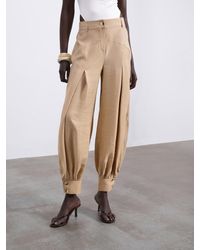 SÉLONE - Nessa Pleated Balloon Trousers - Lyst