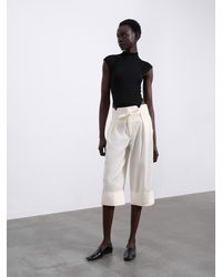 SÉLONE - Alma Cuffed Trousers - Lyst