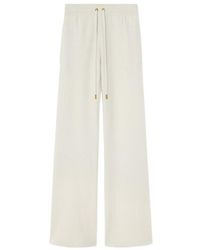 Versace - Drawstring Flared Trousers - Lyst