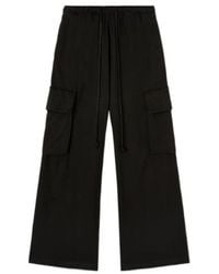 Palm Angels - Low-Rise Drawstring Wide-Leg Cargo Trousers - Lyst