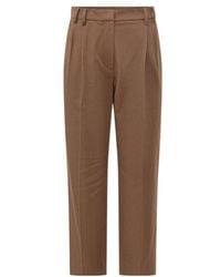 Brunello Cucinelli - Pleated Tapered Trousers - Lyst