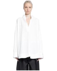 KHAITE - The Tito Curved Hem Top - Lyst