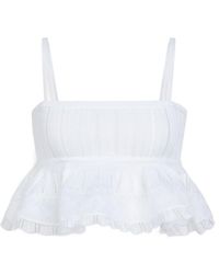 Alaïa - Alaïa Peplum Knit Top - Lyst