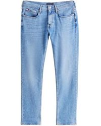 Tommy Hilfiger - Logo-Patch Straight-Leg Jeans - Lyst