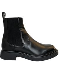Gucci - Gg Embossed Ankle Boots - Lyst