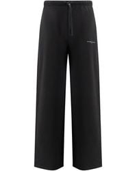 ih nom uh nit - Logo Printed Wide-Leg Trousers - Lyst
