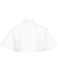 Alaïa - Alaïa Cropped High-Neck Buttoned Top - Lyst