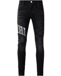 Amiri - Varsity Logo Repair Jeans - Lyst