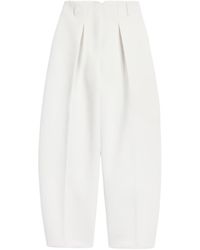 Jacquemus - The Ovalo Curved Leg Trousers - Lyst