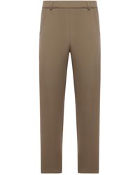 Prada - Triangle-Logo Patch Slim-Fit Trousers - Lyst