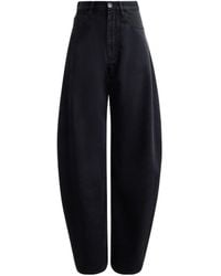 Alaïa - Alaïa High-Waist Round Jeans - Lyst