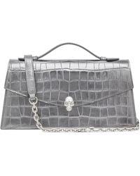 McQueen - Skull Embossed Top Handle Clutch Bag - Lyst
