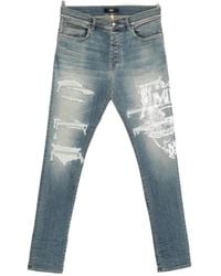 Amiri - Ripped Graphic Printed Jeans - Lyst