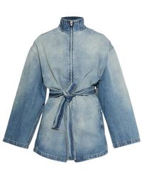 Alaïa - Alaïa Belted Denim Jumpsuit - Lyst