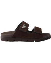 Prada - Enamel-Triangle Slip-On Sandals - Lyst