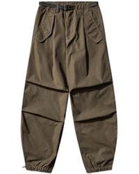 and wander - Side-Zip Hem Pants - Lyst
