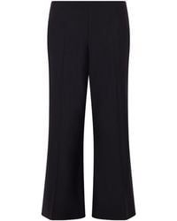 KHAITE - Walter Wool Mid-Rise Flared Leg Pants - Lyst