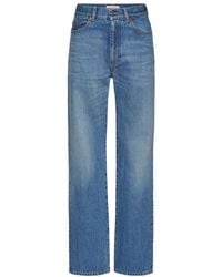 Valentino - Washed Denim Jeans With Archive 1985 Print - Lyst
