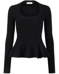 Alaïa - Alaïa Ribbed Peplum Knitted Sweater - Lyst