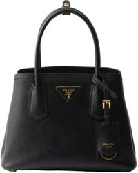 Prada - Logo Plaque Top Handle Bag - Lyst