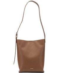 Jil Sander - Cannolo Logo Stamped Small Shoulder Bag - Lyst