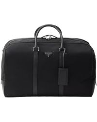Prada - Logo Plaque Zipped Duffle Bag - Lyst