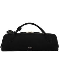 Alaïa - Alaïa Teckel Zipped Clutch Bag - Lyst